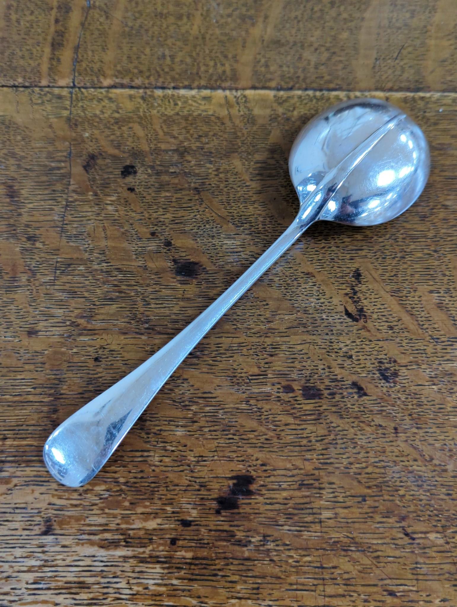 An Edwardian oak cased silver plated table canteen, settings for twelve and a set of silver plated fish knives and forks for twelve